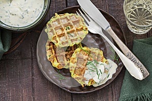 Zucchini wafers with dill and onion, served with sour cream sauce and wine.