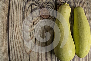 Zucchini on a wooden table. Autumn harvest thanksgiving Day.