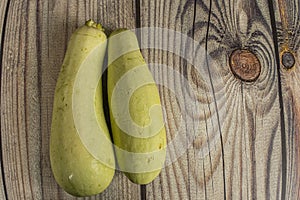 Zucchini on a wooden table. Autumn harvest thanksgiving Day.