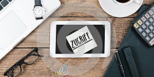 Zugriff, German text for Access , yellow sticky note, office desk with computer technology, high angle