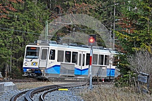 Zugspitze train arrive at Eibsee station photo