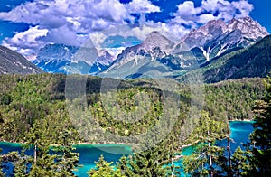 Zugspitze and valley with a cyan lake in the foreground in Biberwier, Tirol photo