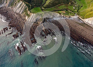 Zumaia flysch geological strata layers drone aerial view