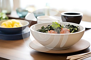 zuppa toscana in black bowl, modern table setting