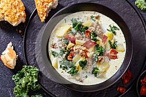 Zuppa Toscana,Tuscan Soup in black bowl, top view