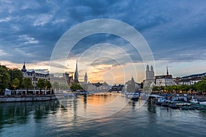 Zurich downtown skyline with Fraumunster and Grossmunster churches at lake zurich at night, Switzerland