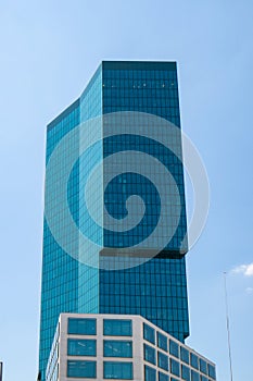 Zurich Prime Tower skyscraper green glass office building. Low wide angle view, sunny summer day, blue sky, no people