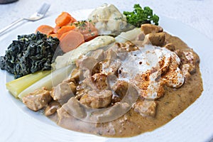 Zurich style veal meat stew with diverse season vegetables: