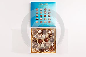 Zurich, Switzerland - January, 7 2023: Lindt Mini Pralines Box. Close up of open small gift box of Swiss chocolate