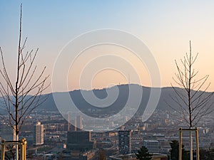 Zurich, Switzerland - March 26th 2022: Panoramic view over the city from the famous viewpoint Waid towards Uetliberg.