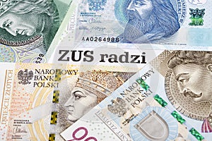 ZUS - Polish Social Insurance Institution - on the background of the Polish Zloty photo