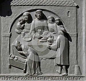 Zwingli and his family, relief on the door of the Grossmunster church in Zurich photo