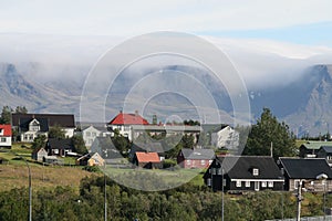 ÃÂrbÃÂ¦jarsafn in ReykjavÃÂ­k on a beautiful day with a fog in the mountain of Esja