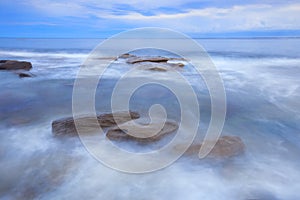 Ã¢â¬Â¨Rocks and waves at Kings Beach, QLD. photo