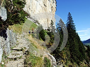 Ãâscher cliff or Ãâscher-Felsen Aescher-Felsen or Ascher-Felsen in the Alpstein mountain range and in the Appenzellerland region photo