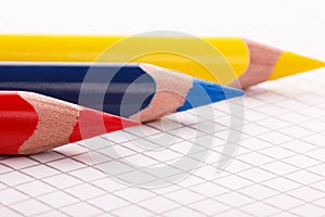 ÃÂ¢hree colored pencil on a sheet of notebook