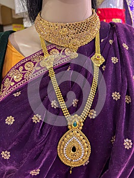 â€‹A woman wearing traditional sari with necklace managlsutra jwellery