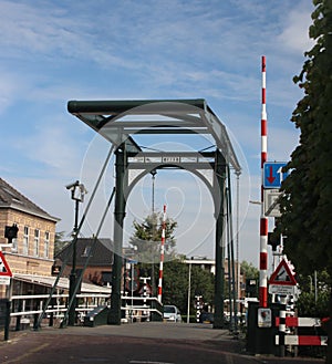 Ã’ld steel drawbridge over river Hollandse IJssel in the city of Haastrecht in the Netherlands