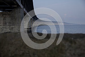 The Ã–resund bridge seen from below as it stretches out to sea from land