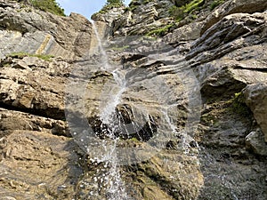 Ã„lggifall waterfall on the Ã„lggibach stream or wasserfall Aelggifall, Sachseln - Canton of Obwald, Switzerland / Schweiz