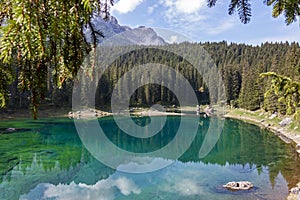 ï»¿ï»¿reflections on Lake Carezza karersee, Nova Levante, South Tyrol.