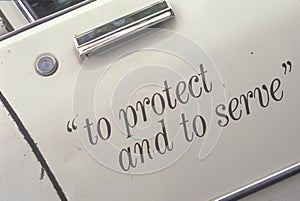 ï¿½To protect and to serveï¿½ on door of LA police car, California