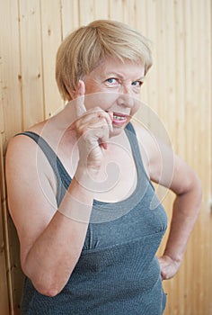 Ð•lderly woman threatens you finger