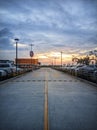 01 November 2023, Cambodia. A parking lot filled with lots of parked cars, paved roads on sunset.