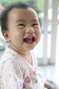 10 month baby with funny face in home living room