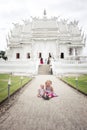 2 little girls (tourist) by Wat Rong Khun