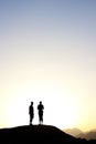 2 people standing on top of a mountain Royalty Free Stock Photo