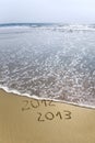 2012 and 2013 written in sand Royalty Free Stock Photo