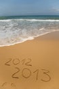 2012 and 2013 written in sand Royalty Free Stock Photo