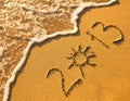 2013 written in sand on beach texture Royalty Free Stock Photo