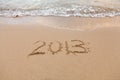 2013 written in sand with waves Royalty Free Stock Photo