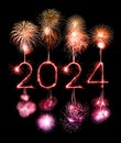 2024 happy new year fireworks celebration written sparkling at night Royalty Free Stock Photo