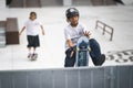 24 september 2023, Almada, Portugal - center of city - teen kid boy skater jumping on rail