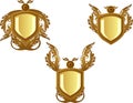 3 Bronze decorated emblems or crests Royalty Free Stock Photo