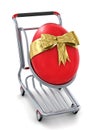 3d big red Easter egg gift in shopping cart icon Royalty Free Stock Photo