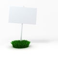 3d blank board on a patch of green fresh grass Royalty Free Stock Photo