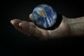 3d Earth on the hand in the dark