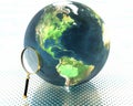 3D earth with magnifier Royalty Free Stock Photo