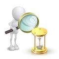 3d person watching a hourglass with a magnifying glass Royalty Free Stock Photo