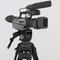 3D render of a video camera on tripod