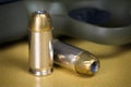 .45 Caliber Hollow Pistol Bullets Near Handgun Royalty Free Stock Photo