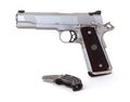 45 caliber pistol and knife Royalty Free Stock Photo
