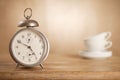 5 o'clock tea time, retro alarm white tea cups Royalty Free Stock Photo