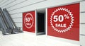 50 percent sale on shopfront windows and escalator