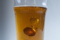 50p coin dropping into a pint of beer Royalty Free Stock Photo