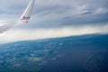 AA.com red and blue brand on aircraft wing above cloud